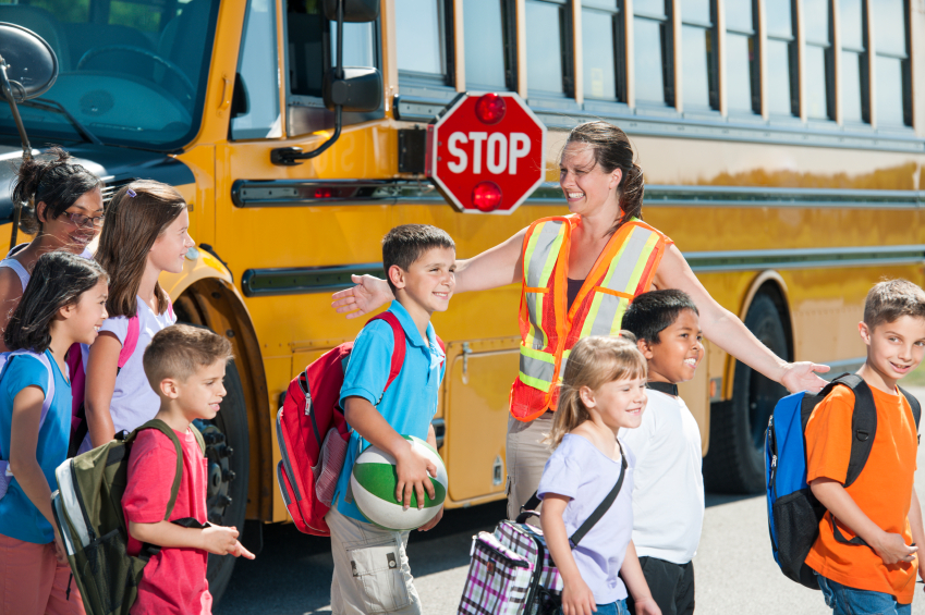 Safe driving tips in a school zone and around a school bus.